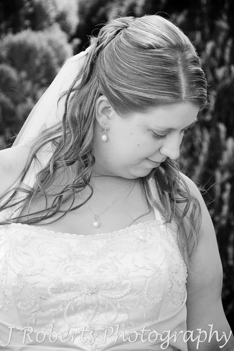 B&W of bride looking down at bouquet - wedding photography sydney